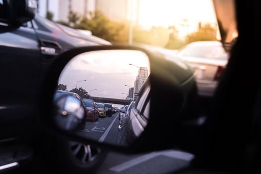 Cars on busy road in the Bangkok city, Thailand. Many cars use the street for transportation in rushhour with a traffic jam