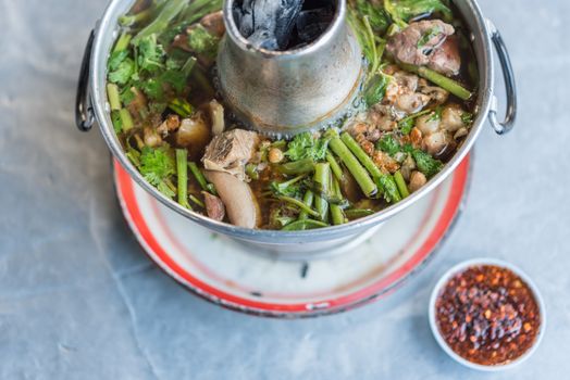 Braised beef clear with meat tendon soup stew (Ekaehla meat) with vegetable in hot pot for sale at Thai street food market or restaurant in Thailand