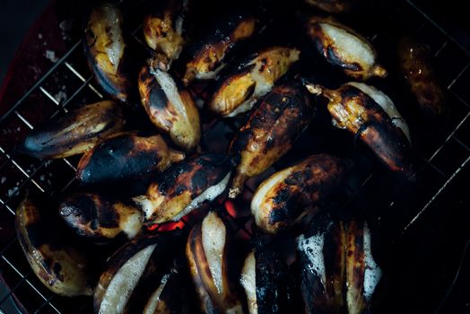 Roasted or Grilled Banana for sale at Thai street food market or restaurant in Thailand