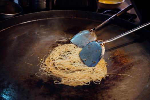 Fried noodle Thai style (Pad Thai) for sale at Thai street food market or restaurant in Thailand