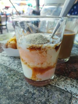 Breakfast food with soft-boiled eggs and vintage coffee Thai style for sale at Thai street food market or Thai vintage style coffee shop restaurant in Thailand