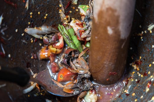 Papaya salad or Papaya Pok Pok (Som tum) for sale at Thai street food market or restaurant in Thailand