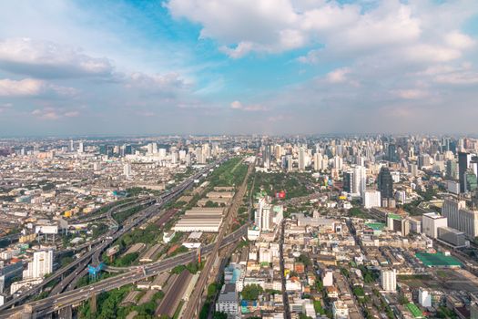 Cityscape and transportation with expressway and traffic in daytime from skyscraper of Bangkok. Bangkok is the capital and the most populous city of Thailand.