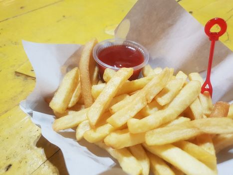 French fries or chips (potato) is a side dish or snack in fastfood restaurant, unhealthy food or fat concept