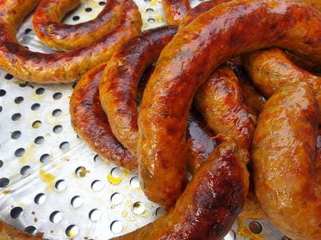 Roasted or Grilled Notrhern Thai Spicy Sausage (Sai Aua) for sale at Thai street food market or restaurant in Thailand