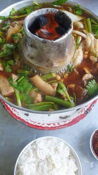 Braised beef clear with meat tendon soup stew (Ekaehla meat) with vegetable in hot pot for sale at Thai street food market or restaurant in Thailand