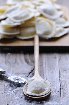 Preparing fresh ravioli at the kitchen table.