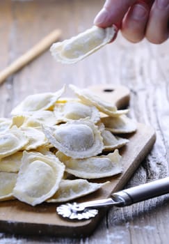 Preparing fresh ravioli at the kitchen table.