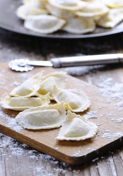 Preparing fresh ravioli at the kitchen table.