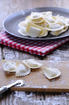 Preparing fresh ravioli at the kitchen table.