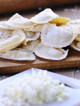 Preparing fresh ravioli at the kitchen table.