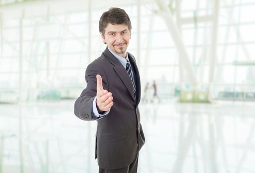 businessman in suit offering to shake the hand at the office