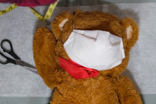 Toy bear in medical mask from a coronavirus