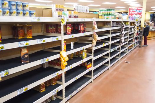 New York, USA - April 2, 2020: Empty shelves with groceries in supermarkets because of the panic from the coronavirus.