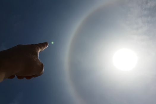 The phenomenon of halo in the sky. A rare natural phenomenon. Three halo suns.