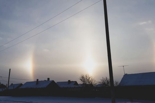 The phenomenon of halo in the sky. A rare natural phenomenon. Three halo suns.