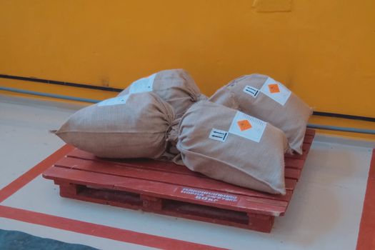 Bags on a pallet. Storage of bags of rubbish