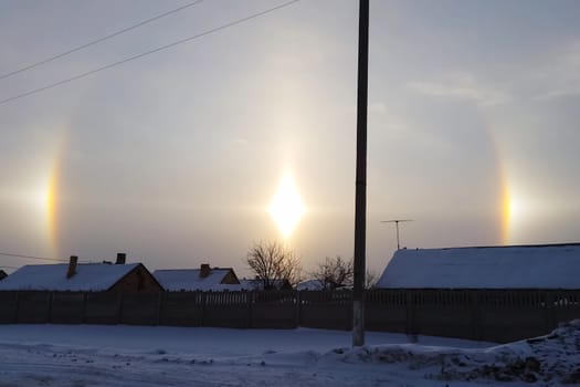 The phenomenon of halo in the sky. A rare natural phenomenon. Three halo suns.