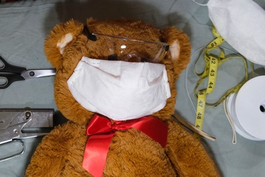 Toy bear in medical mask from a coronavirus