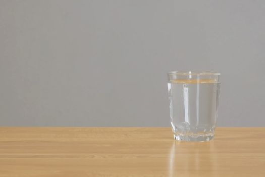 A glass of water on the table. Pure water in a glass.