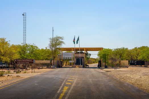 Etosha, Namibia - April 4, 2019 : Anderson Gate to Etosha National Park in Namibia and the entrance sign.