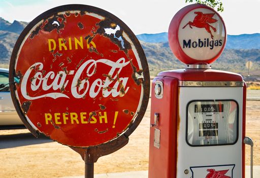 ROUTE 66, ARIZONA, USA - MAY 15, 2013: Retro gas pump and a rusty coca-cola sign on historic route 66 in Arizona.