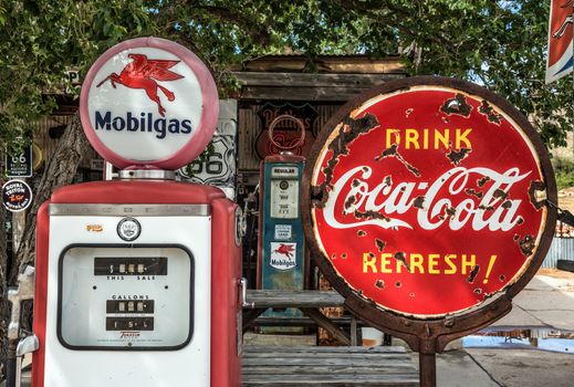 HACKBERRY, ARIZONA, USA - MAY 19, 2016 : Retro gas pump and a rusty coca-cola sign on historic Route 66 in Arizona