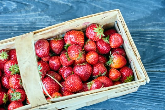 Strawberries in a wicker basket during spring in Poland