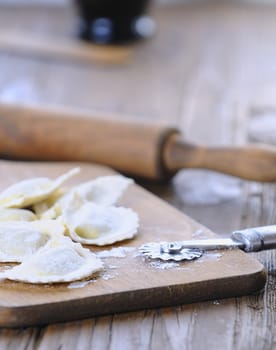 Preparing fresh ravioli at the kitchen table.