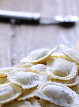 Preparing fresh ravioli at the kitchen table.