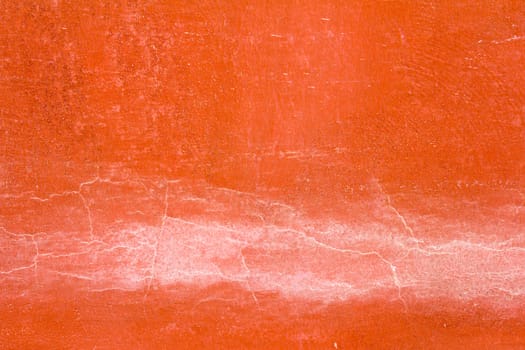 Orange color concrete wall with the crack background