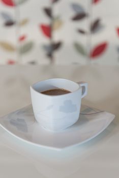 Morning coffee cup on white table