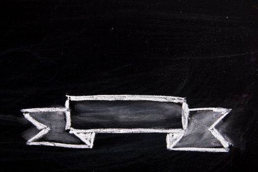 Blank ribbon draw by white chalk on black board background