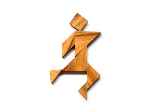 Wooden tangram as happy man shape on white background (Concept as business has success)