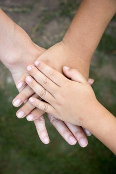 Background of hands of asian female adult and two kids group together for support 