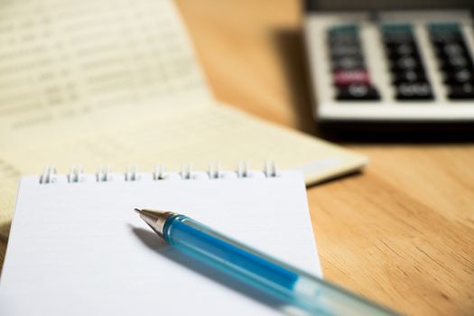 Background of passbook, note book with pen, calculator