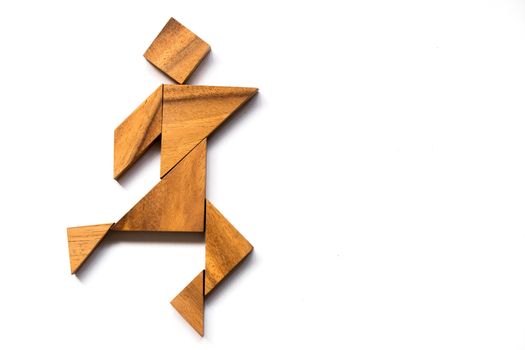 Wooden tangram as happy man shape on white background (Concept as business has success)