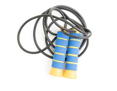 Blue and yellow skipping rope, isolated on white