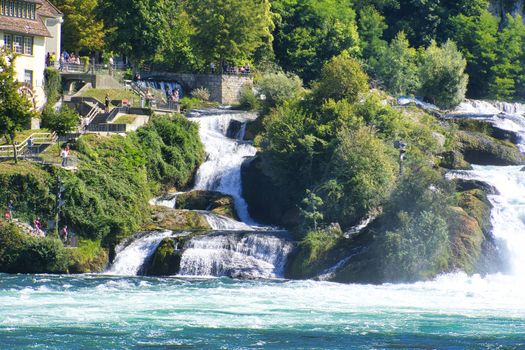 the famous rhine falls in the swiss near the city of Schaffhausen - sunny day and blue sky