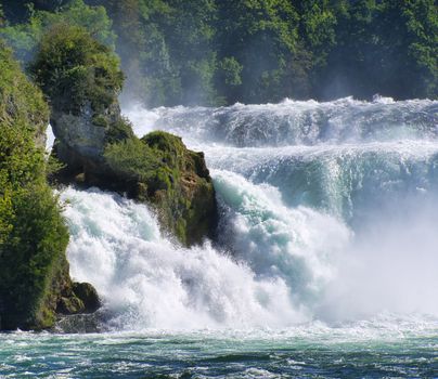 the famous rhine falls in the swiss near the city of Schaffhausen - sunny day and blue sky