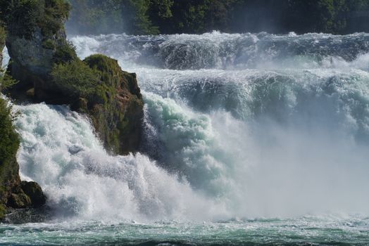 the famous rhine falls in the swiss near the city of Schaffhausen - sunny day and blue sky