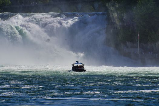 the famous rhine falls in the swiss near the city of Schaffhausen - sunny day and blue sky