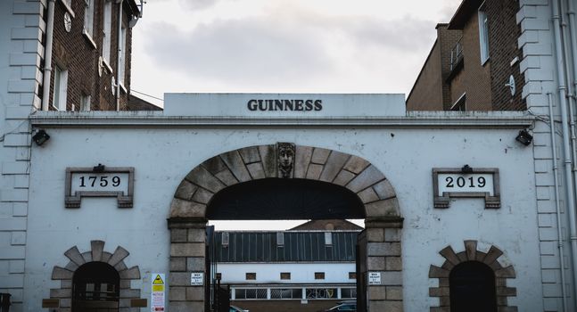Dublin, Ireland - February 13, 2019: View of the Guiness Distillery storefront in the historic city center on a winter day