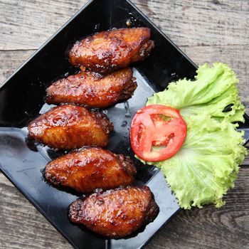 Fried chicken on wood background