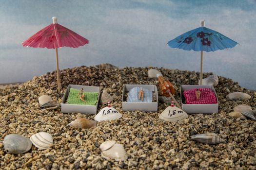 little figures to the beach with 1.5 m distance because of the corona rules social distance