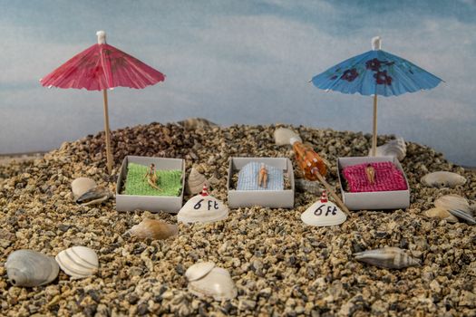 little figures to the beach with 6 feet distance because of the corona rules social distance