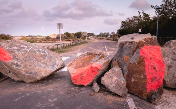 Bretignolles sur Mer, France - October 9, 2019: Barricade of wood, stone and mobile barrier on a ZAD (Acronym of Zone to Defend) protest zone against the construction of the boat harbor