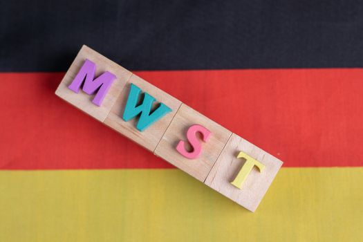 MWST or German Value Added Tax on german flag.