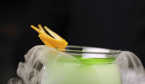 Close up Grape Martini Cocktail cooling in a bowl with dry ice