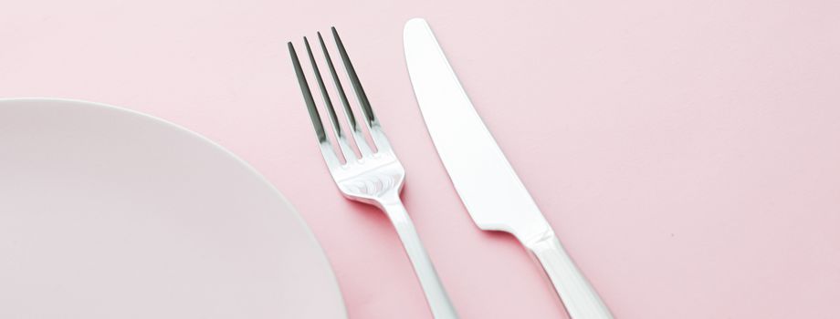 Empty plate and cutlery as mockup set on pink background, top tableware for chef table decor and menu branding design